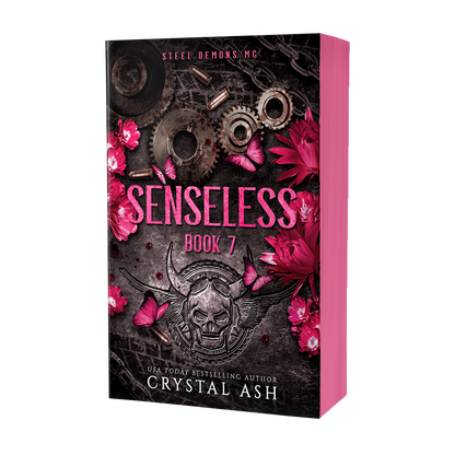 Book cover of 'Senseless Book 7' by Crystal Ash with mechanical elements and pink flowers on a black background.
